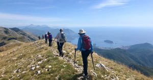 Group of hikers hiking on mountain in Montenegro