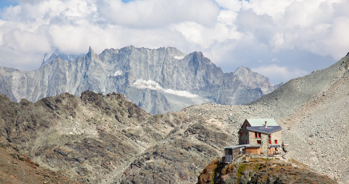 This mountain refuge is huge but look small in this environment.