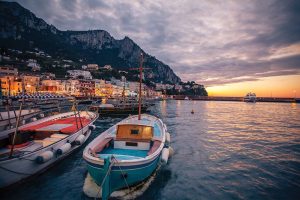 Sailboats at sunset in Capri, Italy