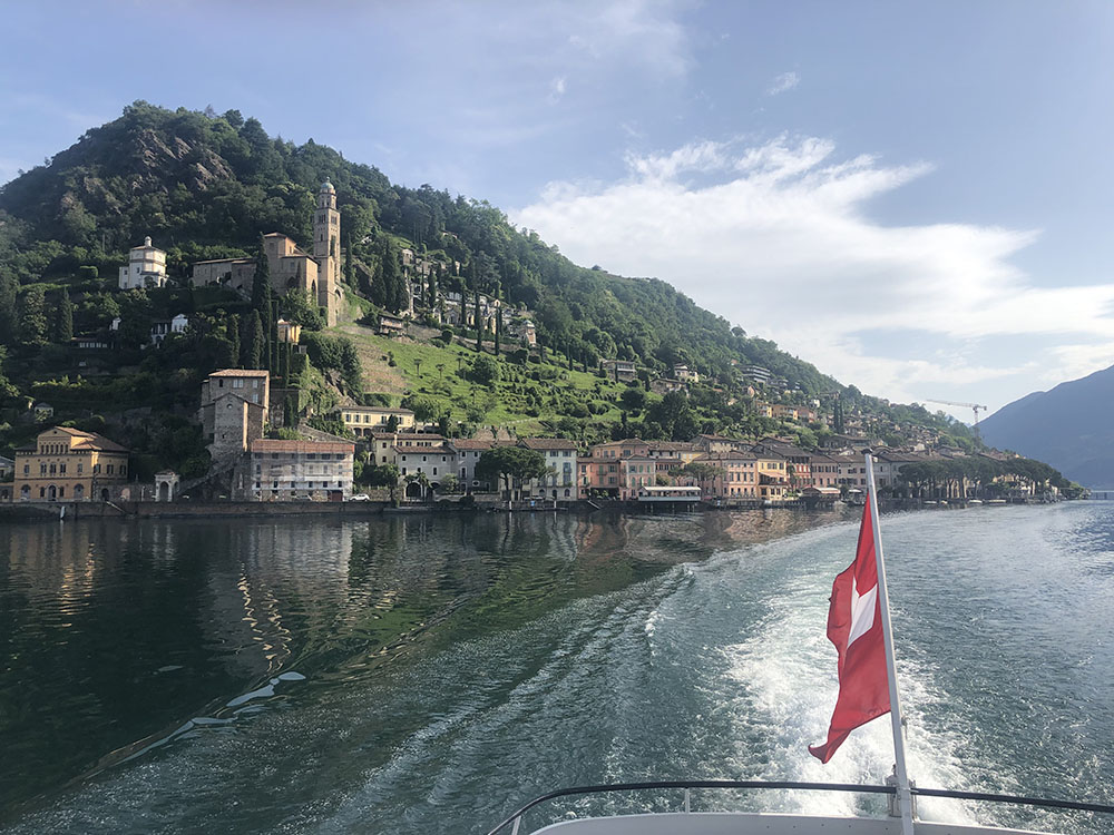 Boat in Ticino Lakes District with Swiss flag