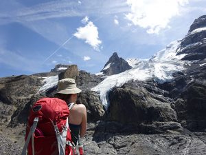 A Ryder-Walker hiking tour guest photographs the Blüemlisalpgletscher in Switzerland's Berner Oberland.