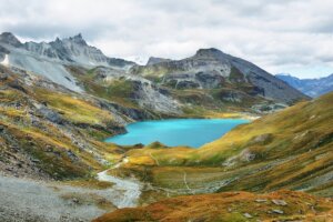 Turquoise lake with surrounding mountains
