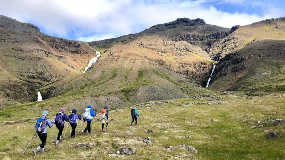 A group of people hiking through Iceland