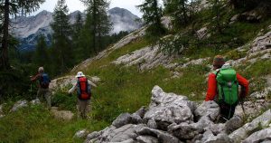 Three people hiking the Julian alps of Slovenia