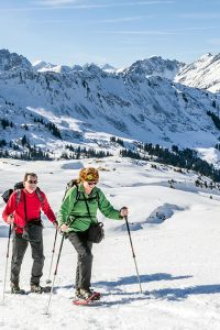 Snowshoers hiking through the Swiss Engadine