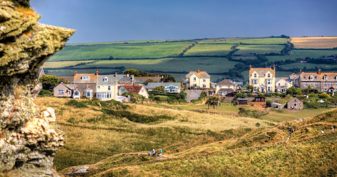 Pastel lighting looking at the town of Tintagel, Cornwall.