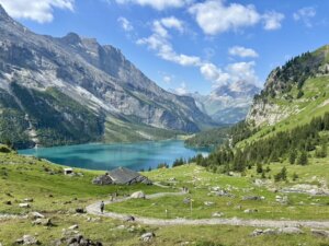A lake and hikers in Switzerlands Berner Oberland