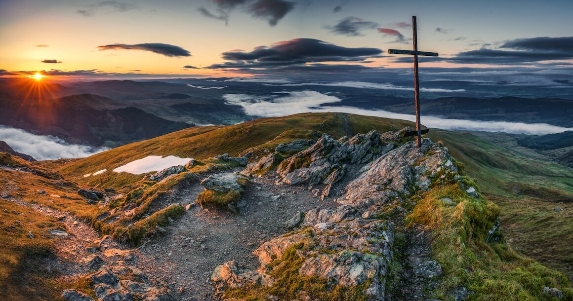 Sunrise on the summit of Ben Ledi with a cross