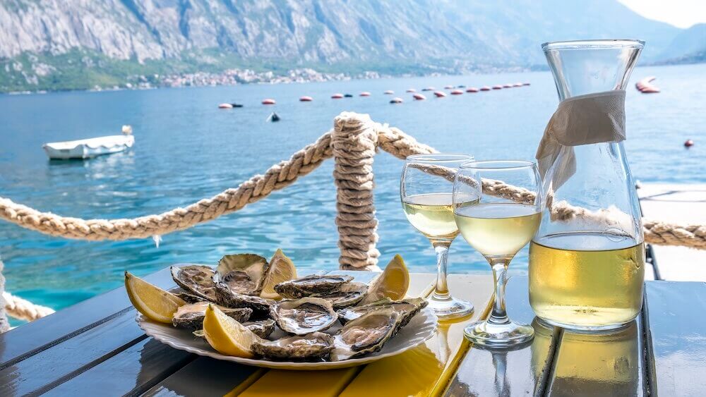 Wine and oysters with a view of Montenegro