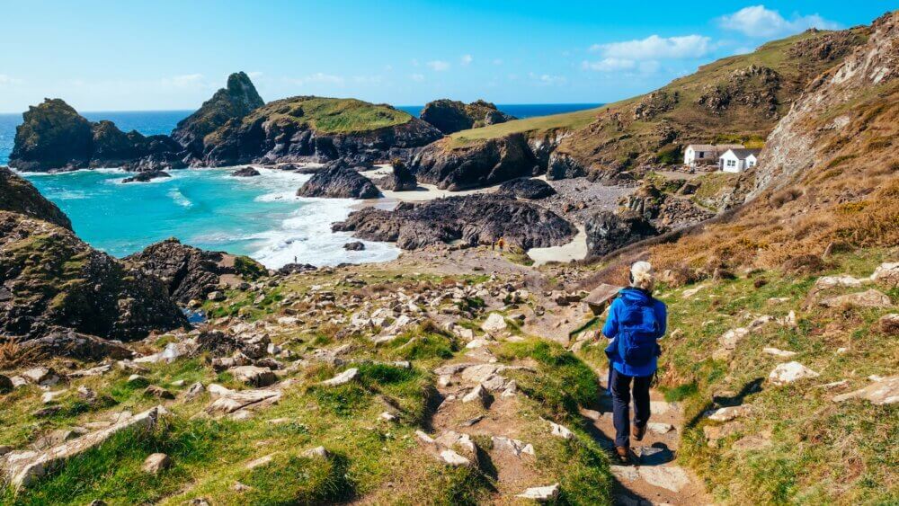 Senior woman walking the coastal path