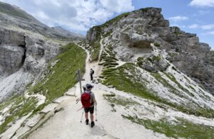 A hiker on the trail in the Dolomites